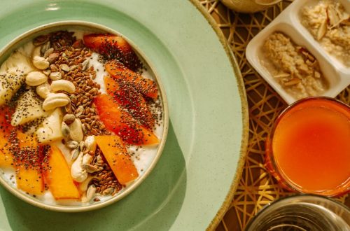A vibrant breakfast bowl with yogurt, fruits, and seeds, perfect for a healthy morning start.